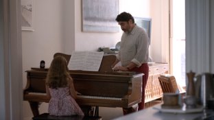 George giving a private piano lesson.